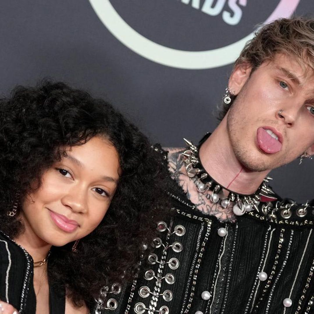 Machine Gun Kelly shows off his parenting skills after cutting himself with a glass