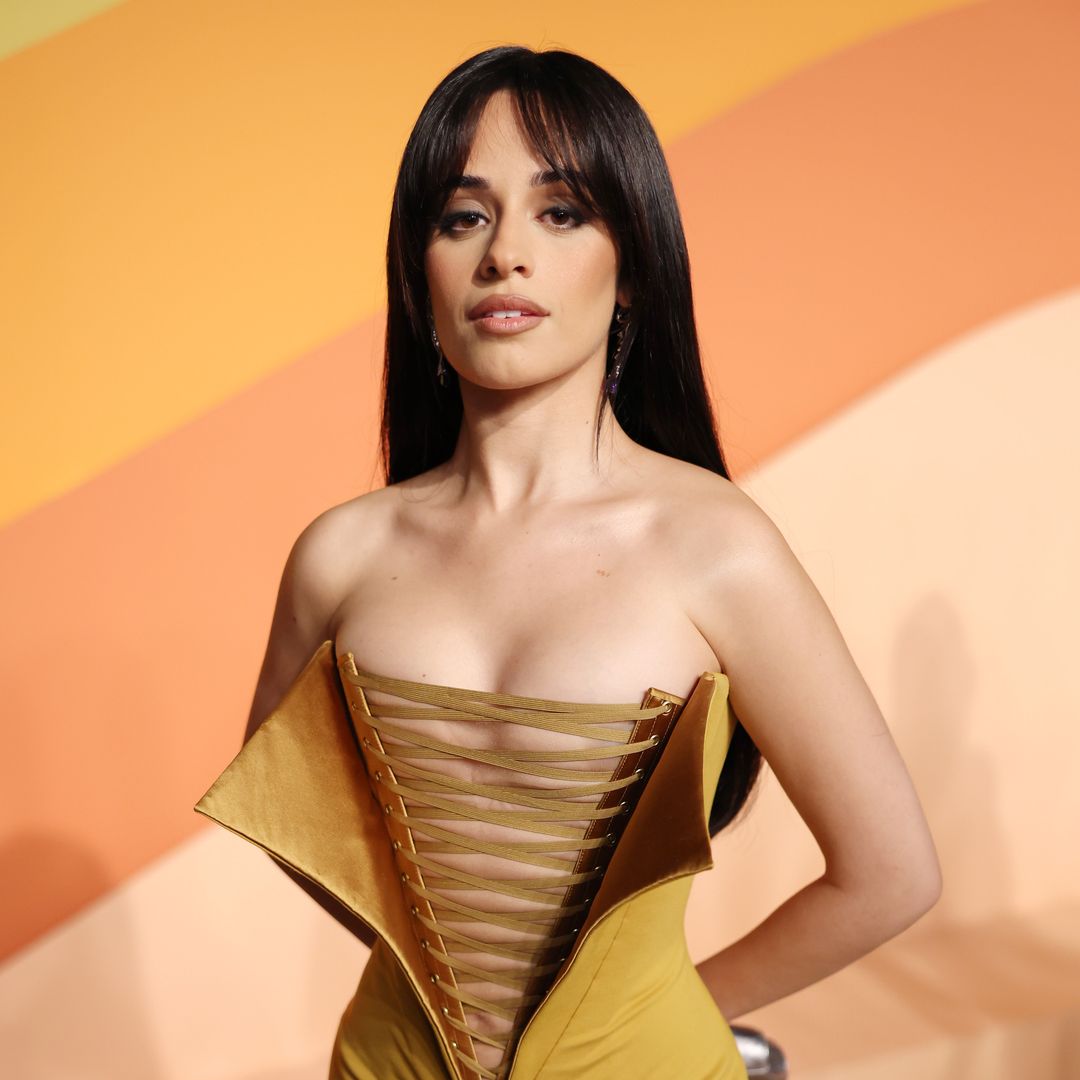 Camila Cabello rocks the hottest color of the season posing in bold cutout minidress