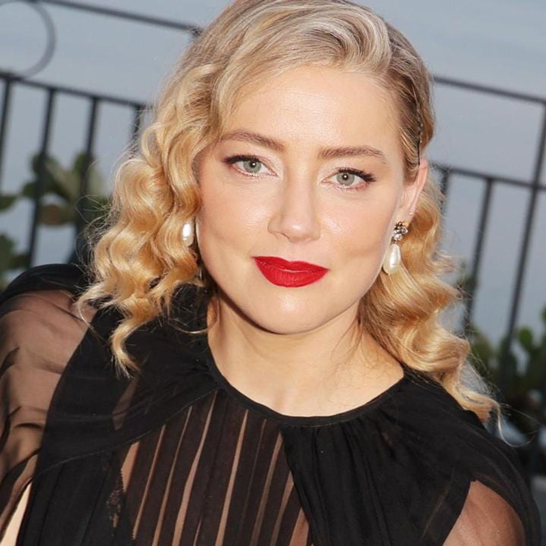 Amber Heard is all smiles celebrating her birthday with champagne