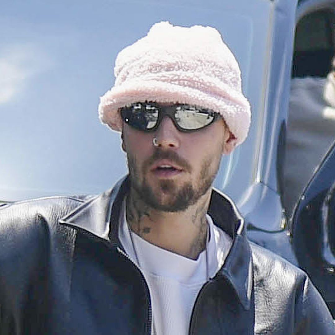 Justin Bieber wears giant fluffy pants while snapping at paparazzi at a Los Angeles flea market