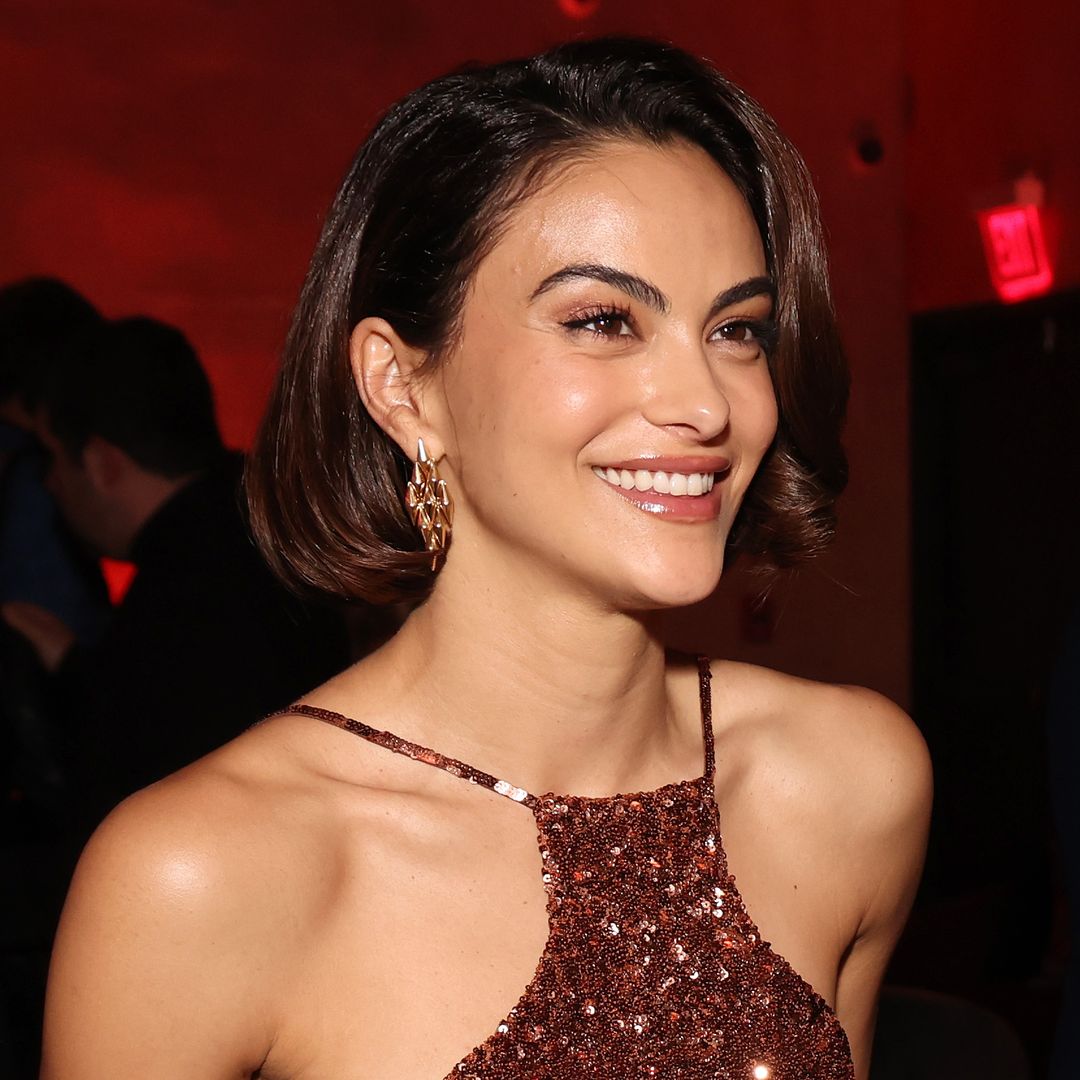 Camila Mendes leans into the visible underwear trend in sheer burgundy look in Brazil