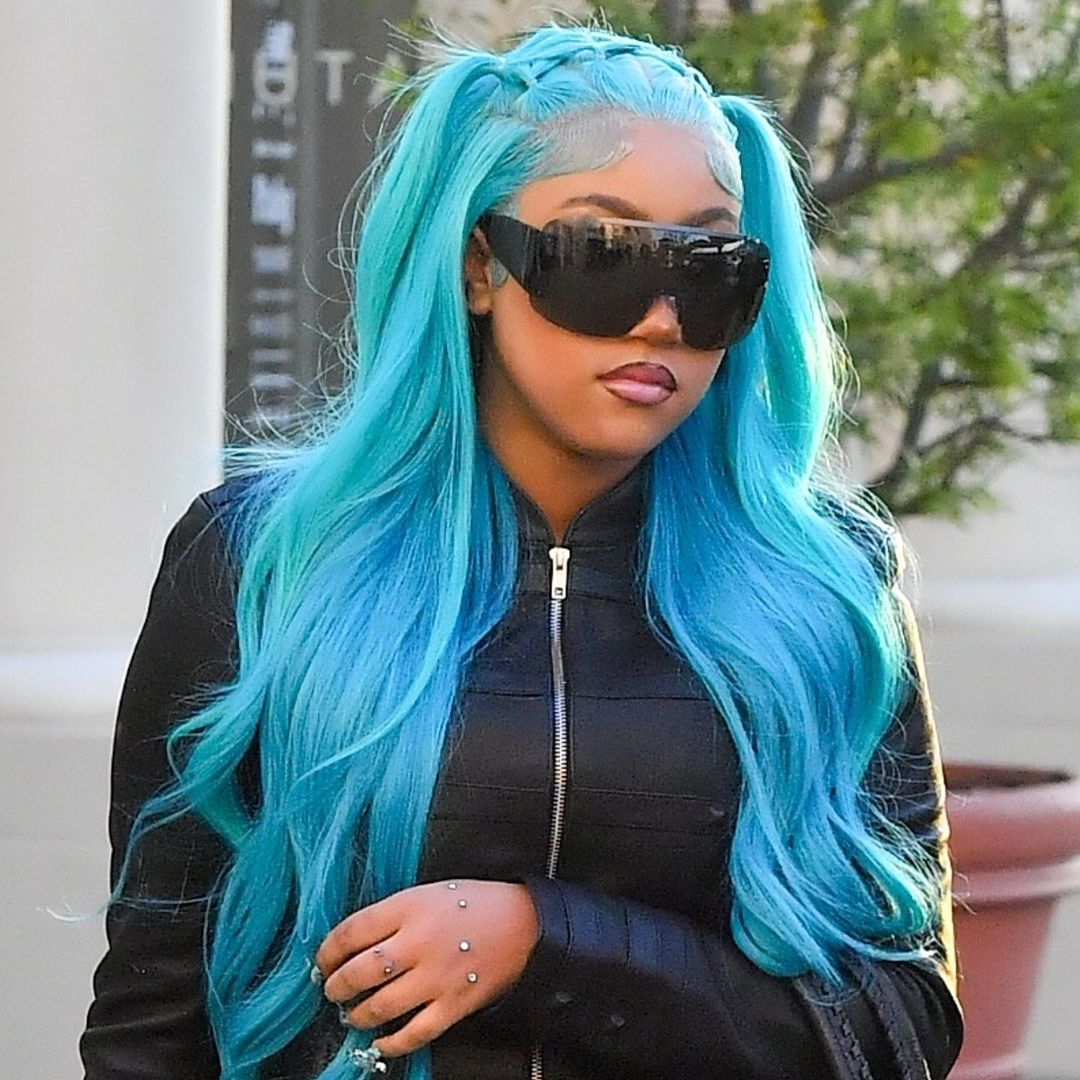 North West rocks an all-leather look, hand piercings and signature blue hair in Los Angeles