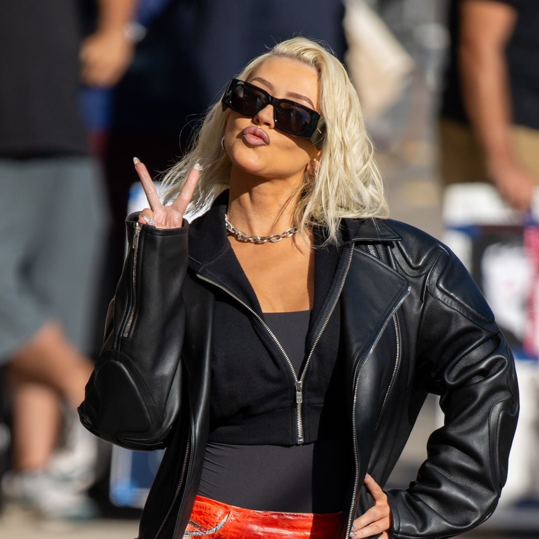 Christina Aguilera stuns once again in a red swimsuit and heels