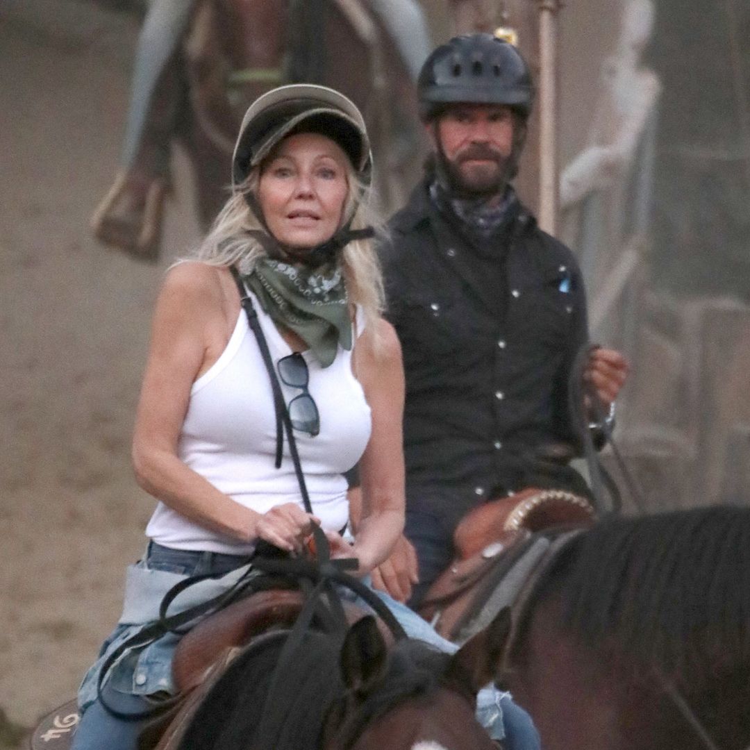 Heather Locklear and Lorenzo Lamas saddle up and smooch ahead of her 64th birthday