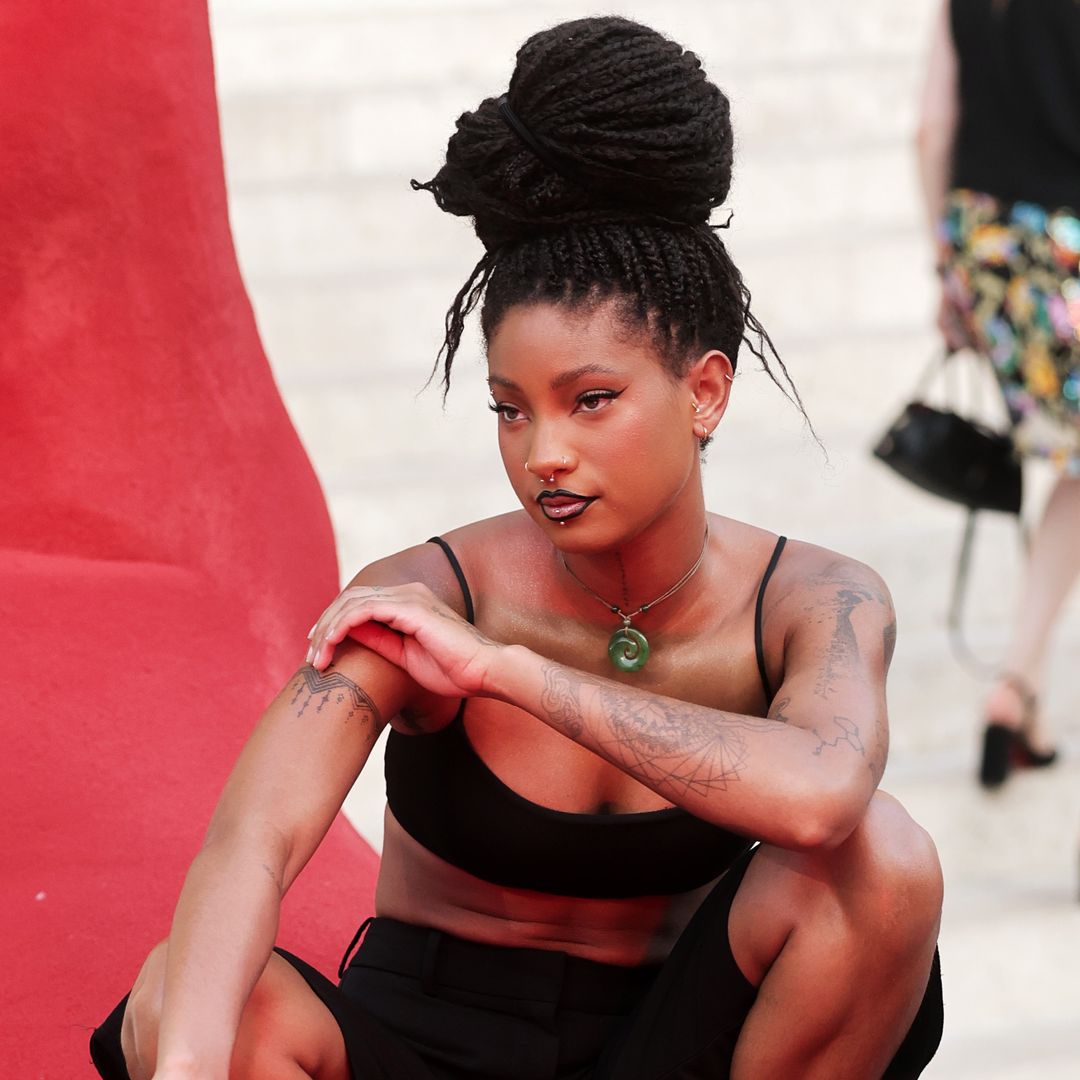Willow Smith turns heads in crop top, tailored shorts and sculptural braided updo at Paris Fashion Week