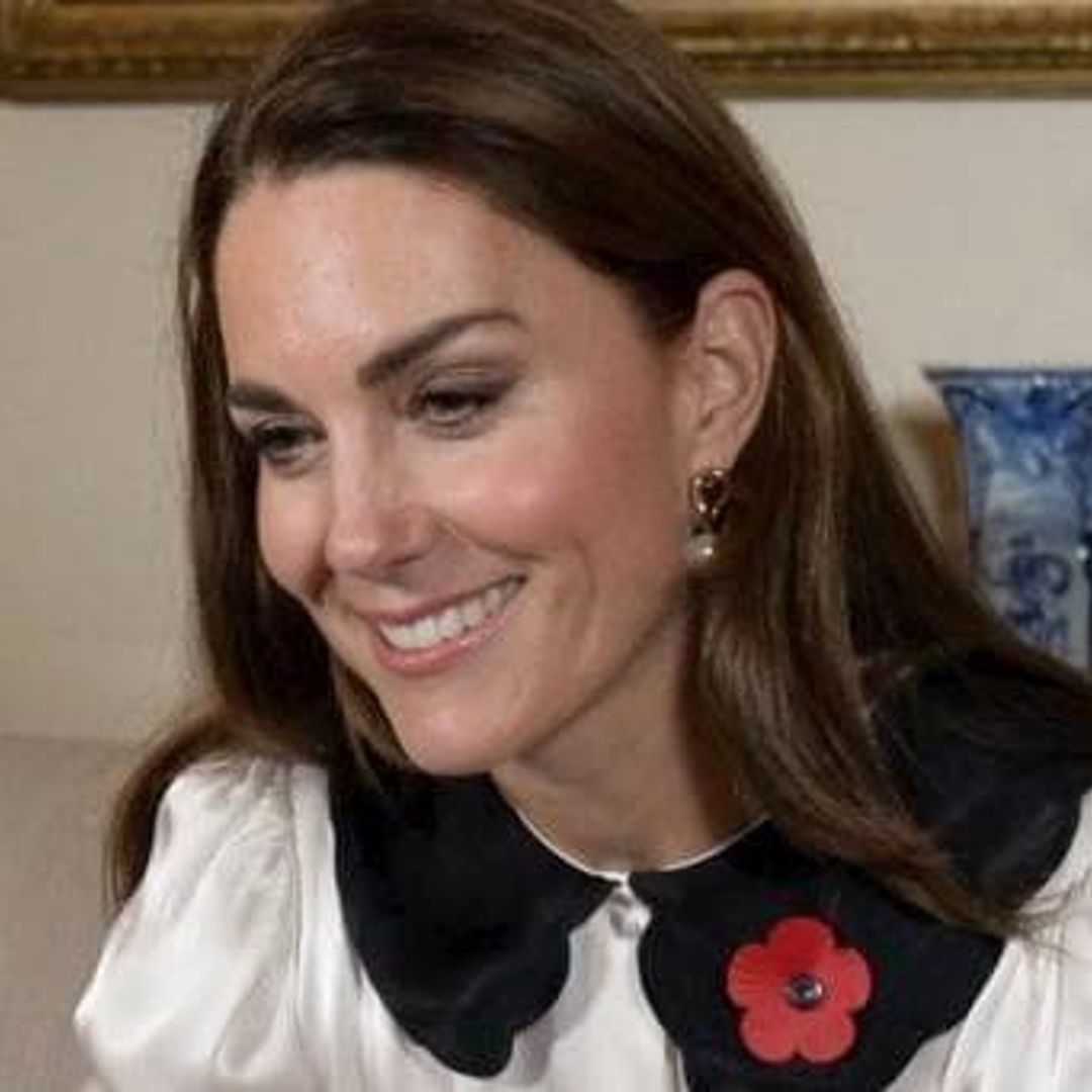 Kate Middleton speaks to military families surrounded by her own family photos