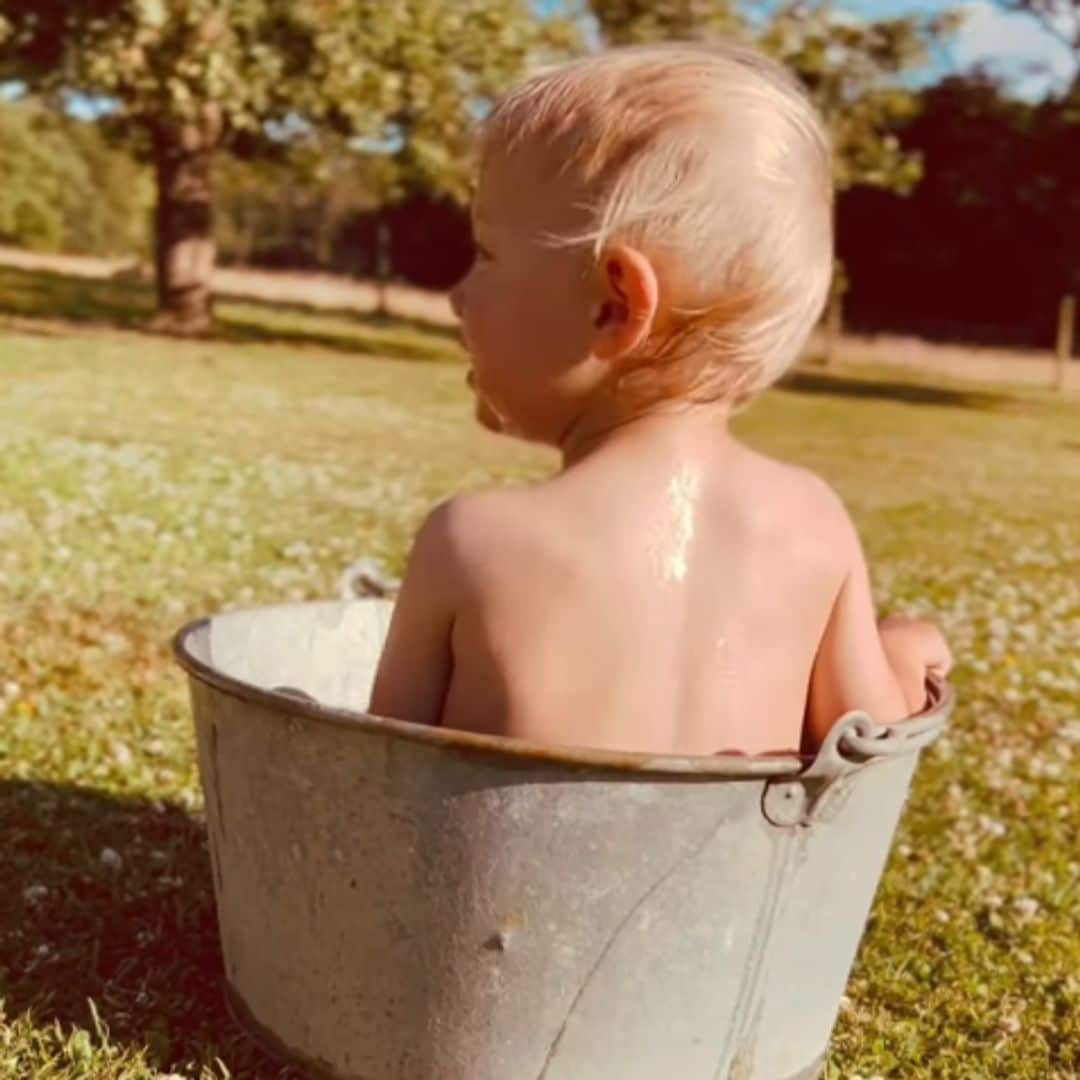 The Princess of Wales’ nephew adorably takes a bath in a bucket outdoors