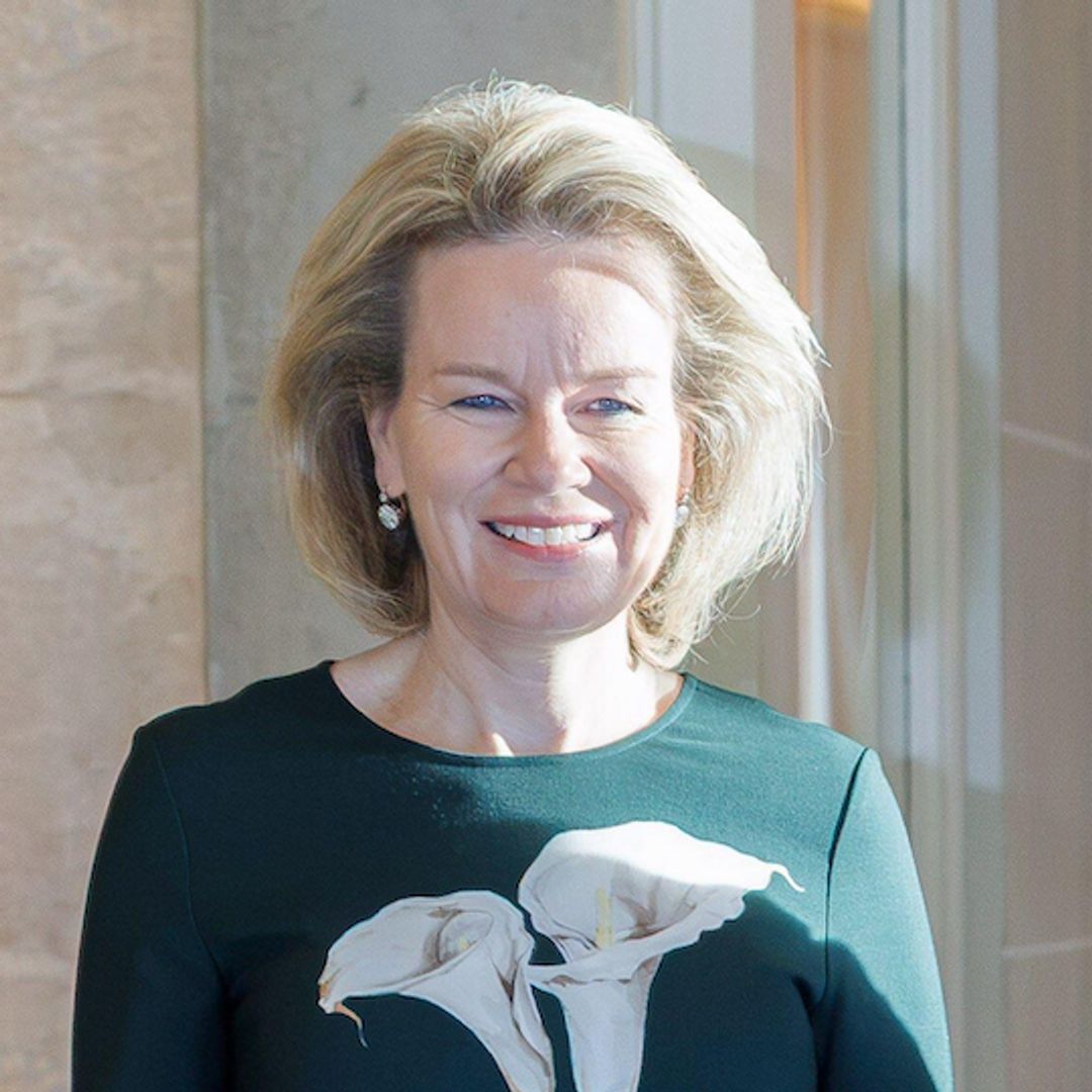 Queen Mathilde brings a romantic touch to fall fashion in a striking emerald-green dress