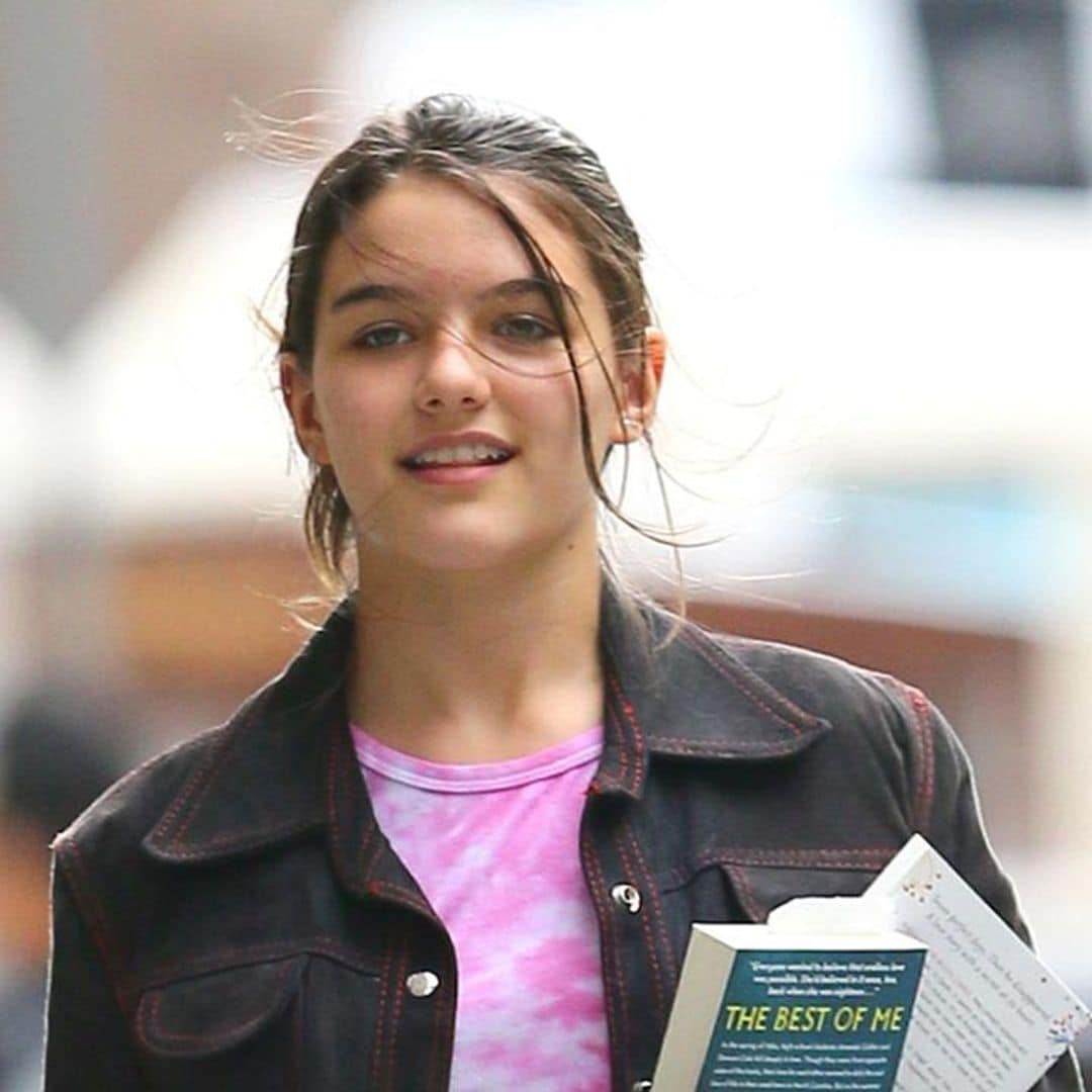 Suri Cruise enjoys New York City weather in a red strapless top and jeans
