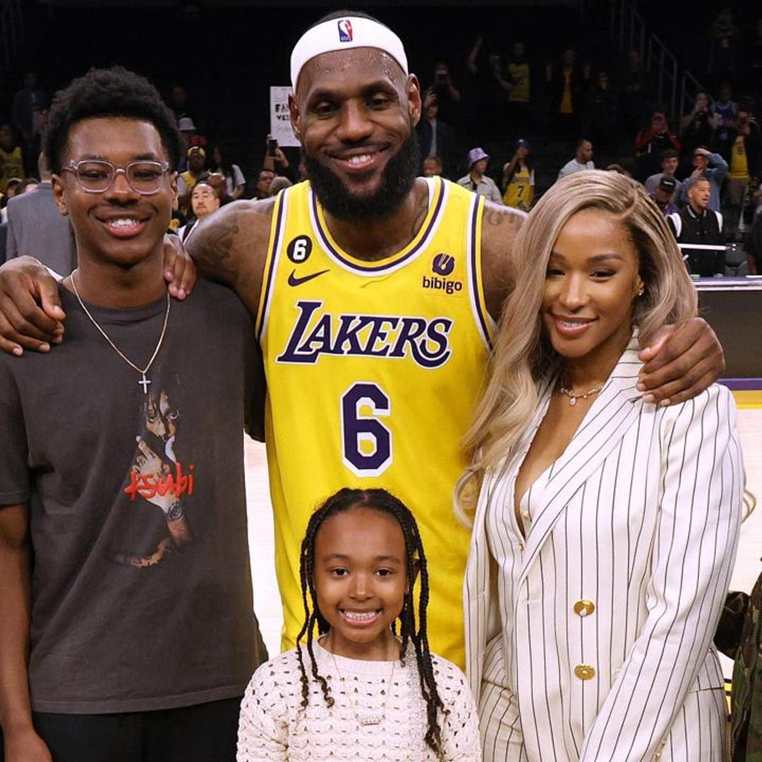 Lebron James and his wife celebrate as he breaks NBA record