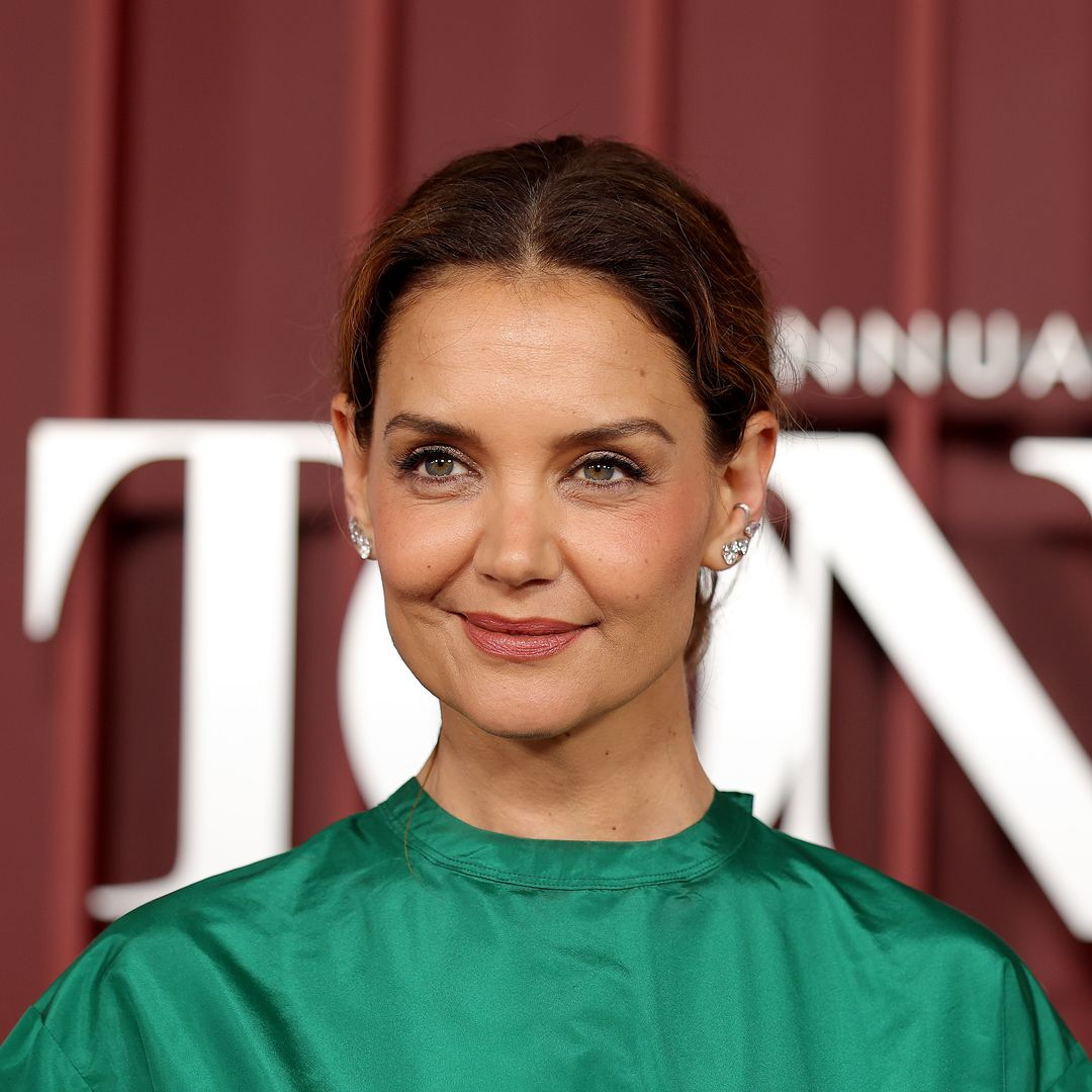 Katie Holmes turned heads in pink satin skirt and emerald green top: 'Elphaba meets Glinda'