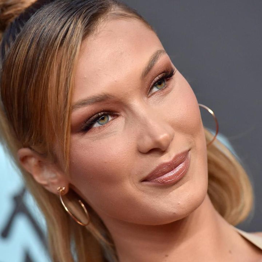Bella Hadid wore Burberry boots and a crop top to make snow angels