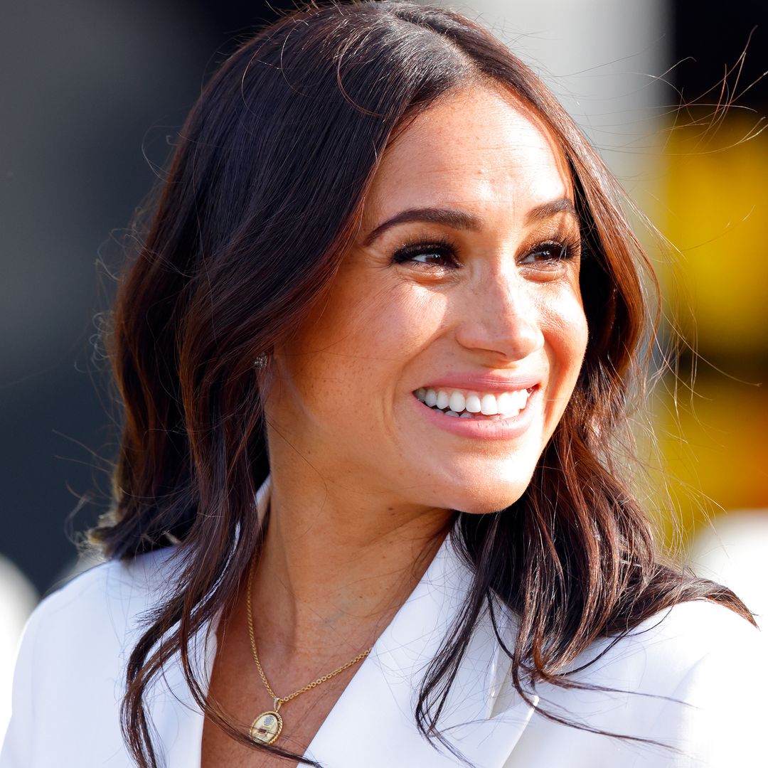 Meghan Markle shares never-before-seen photos of her kids and bare baby bump for special occasion 