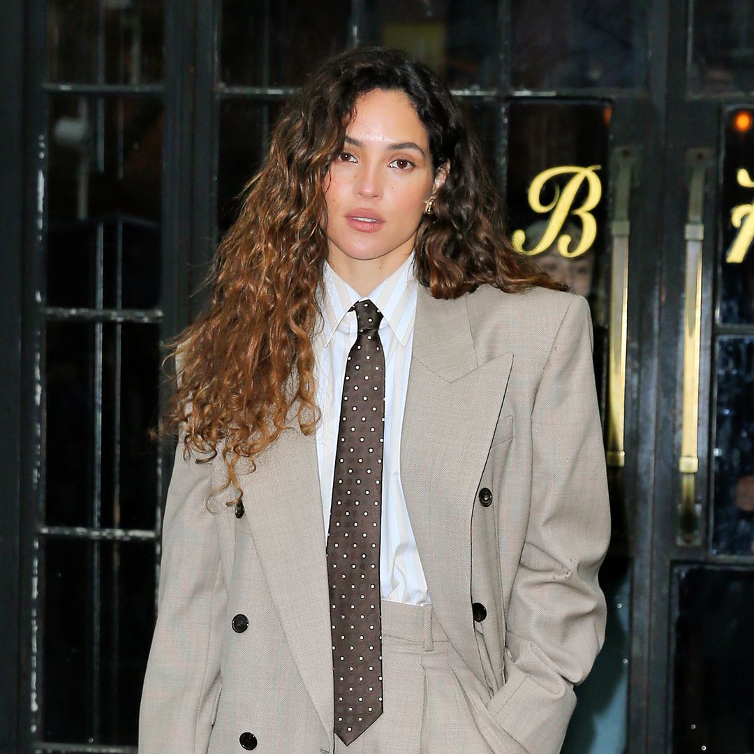 Adria Arjona turns heads with sexy twist on oversized suit in latest NYC outing
