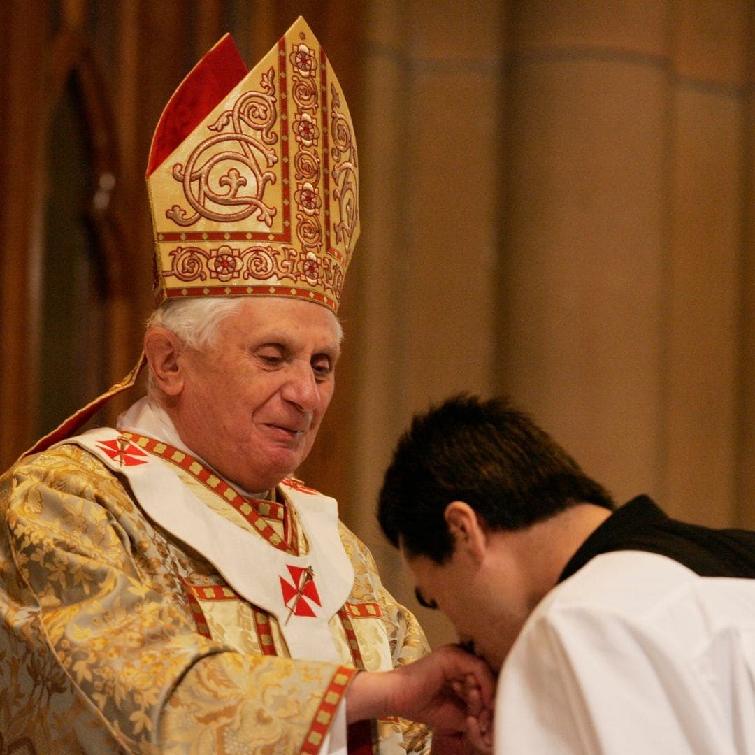 A seminary member kissing Pope Benedict XVI's ring
