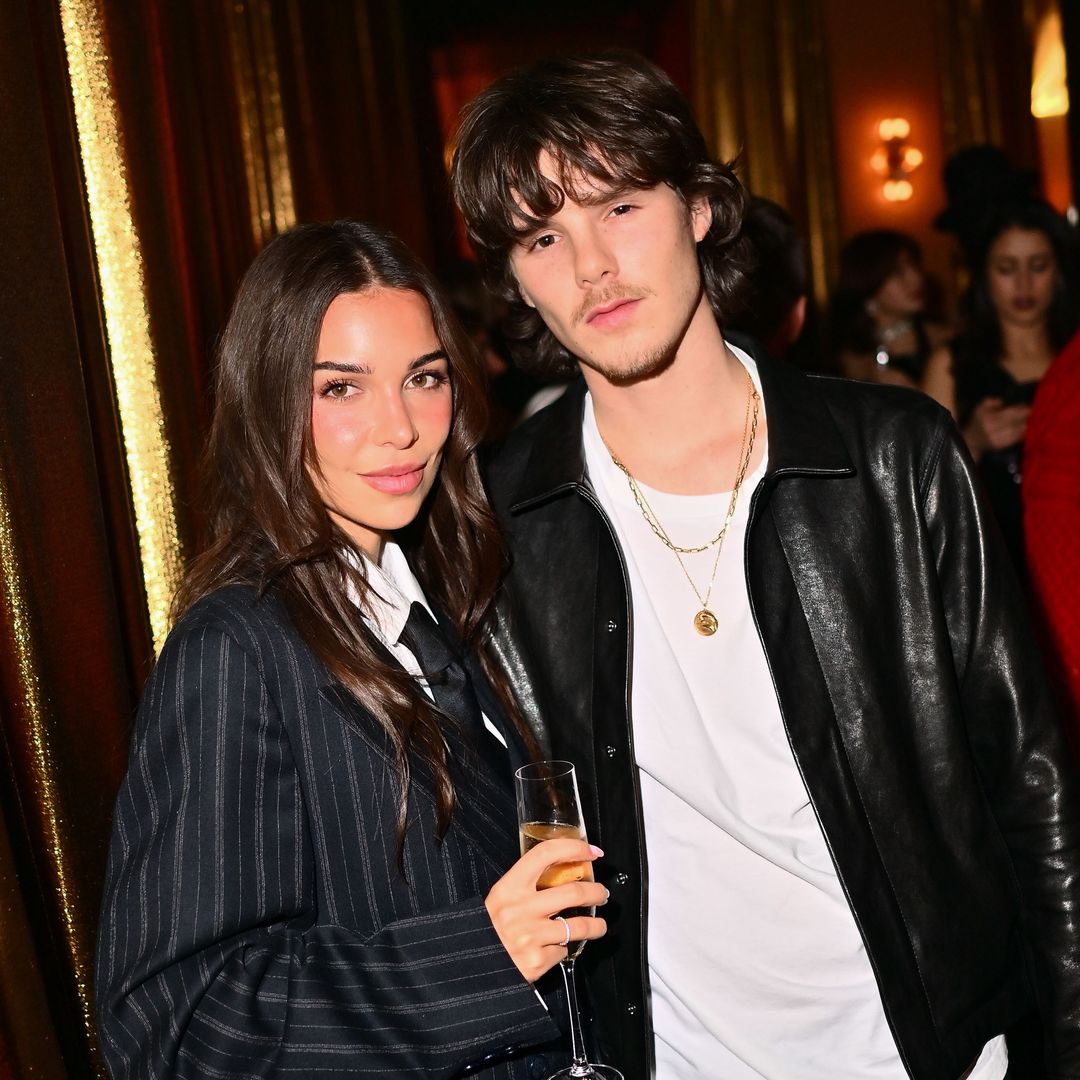 Cruz Beckham and new girlfriend Jackie Apostel are all smiles in Paris to support Victoria Beckham