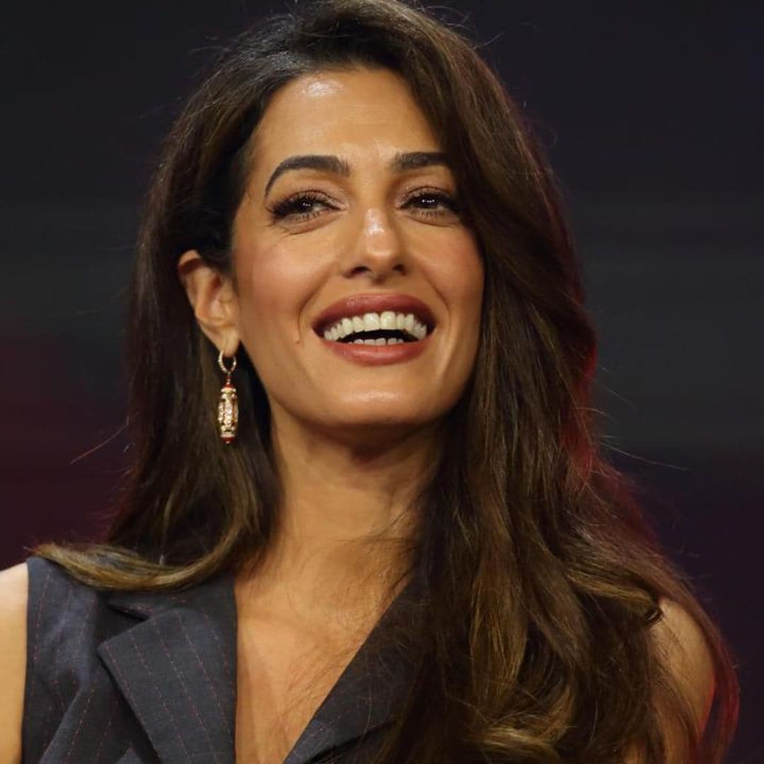 Amal Clooney mastered the disco look in dazzling mini dress during recent outing in Italy