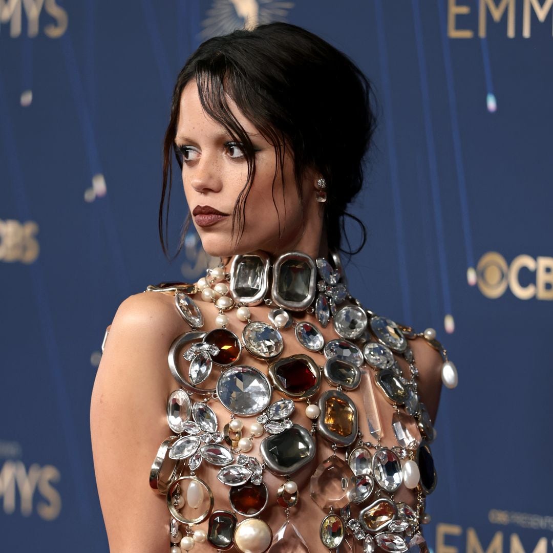 Jenna Ortega poses in jewel-encrusted naked top and bleached eyebrows honoring Isabella Rosellini’s iconic role