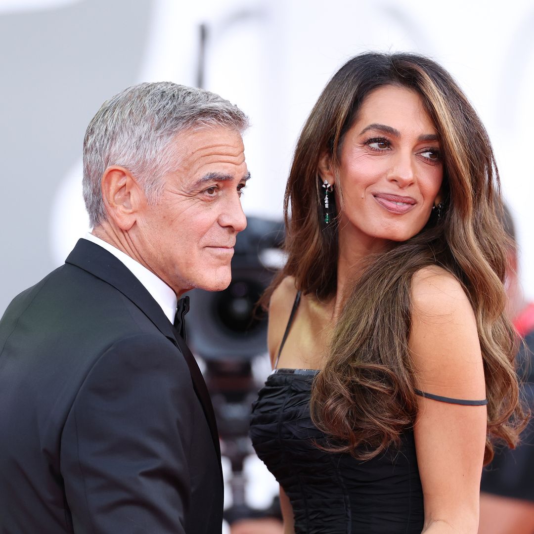 Amal Clooney makes glamorous red carpet return and shares tender moment with George