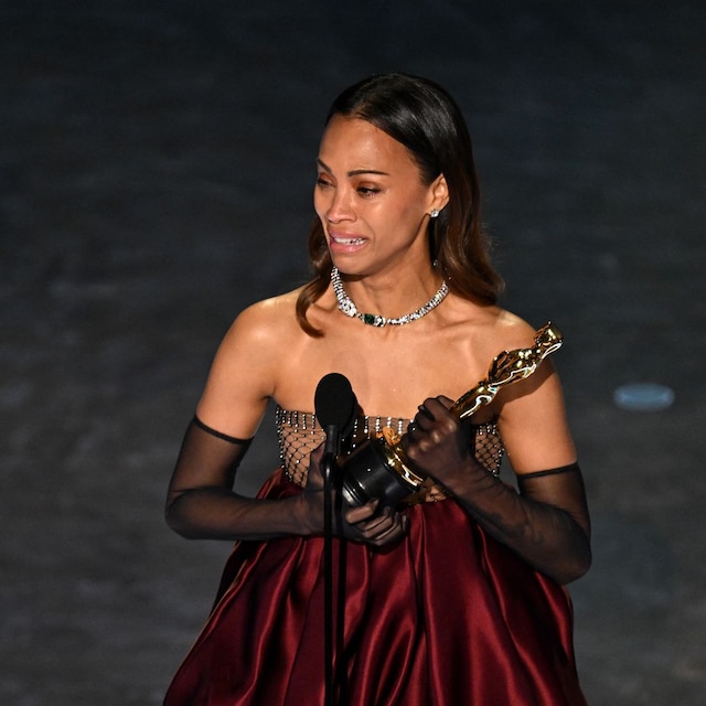 US actress Zoe Saldana accepts the award for Best Actress in a Supporting Role for "Emilia Perez" onstage during the 97th Annual Academy Awards 