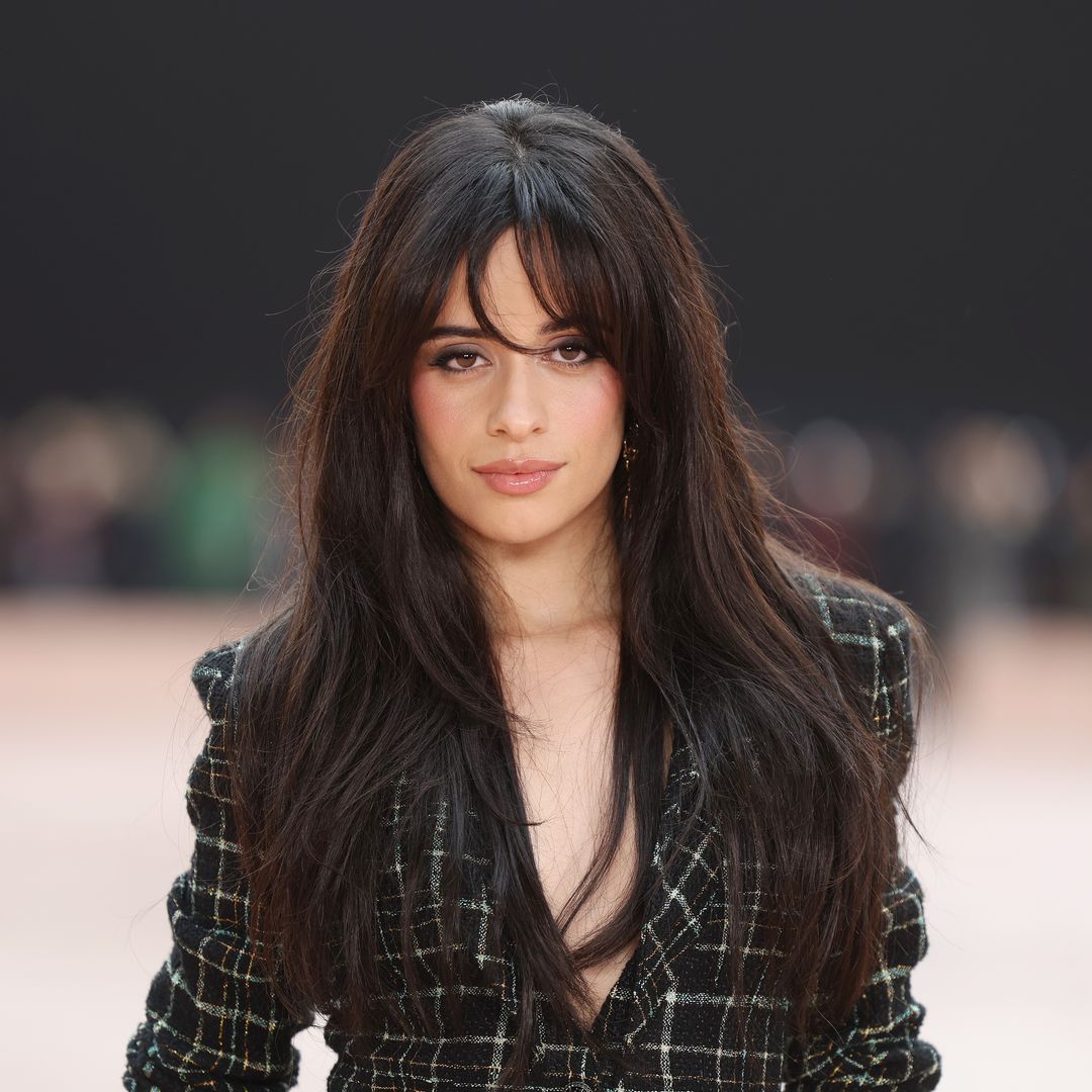 Camila Cabello steps out in figure-hugging minidress and knee-high boots in LA