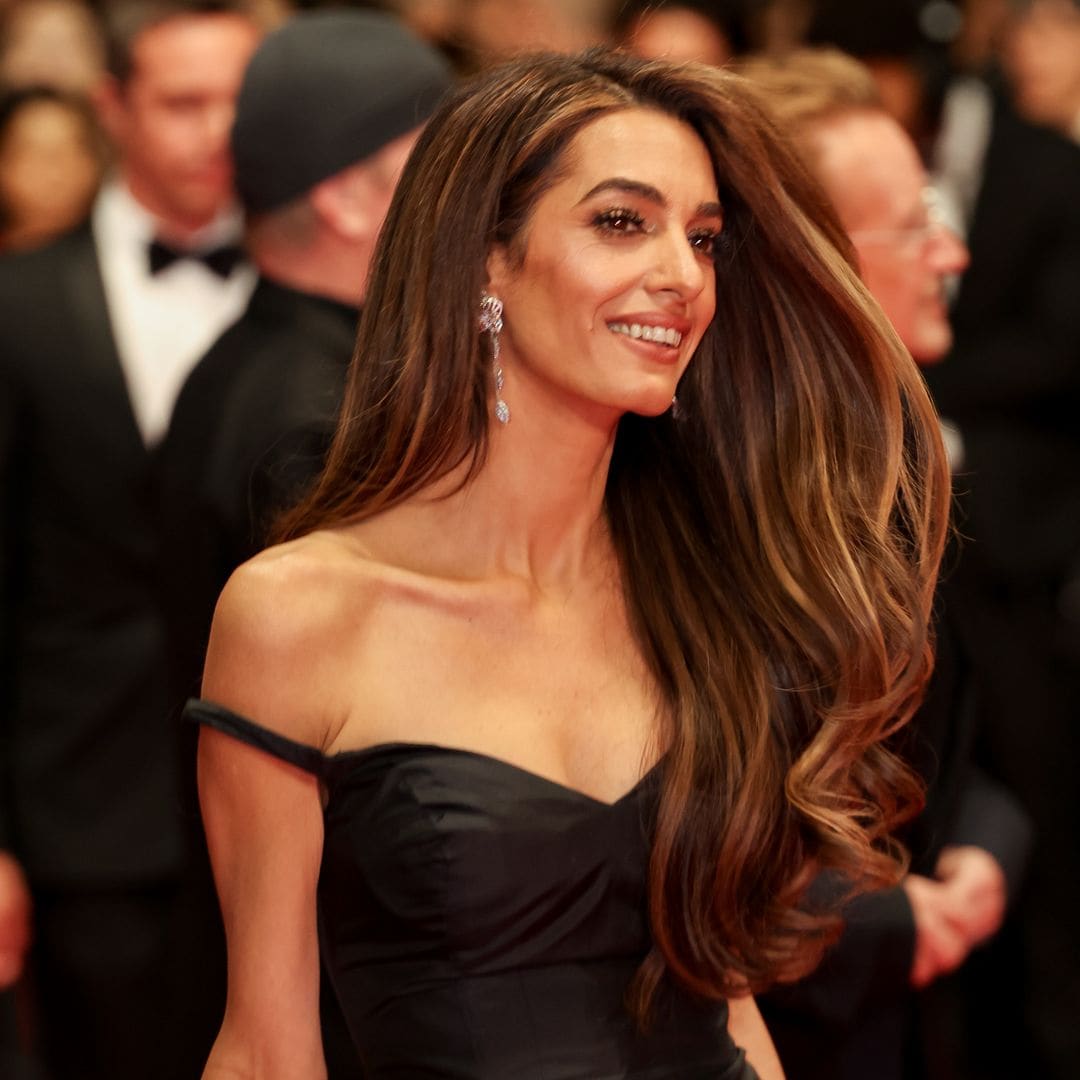 Amal Clooney posed in gold corset dress with Karlie Kloss during special event