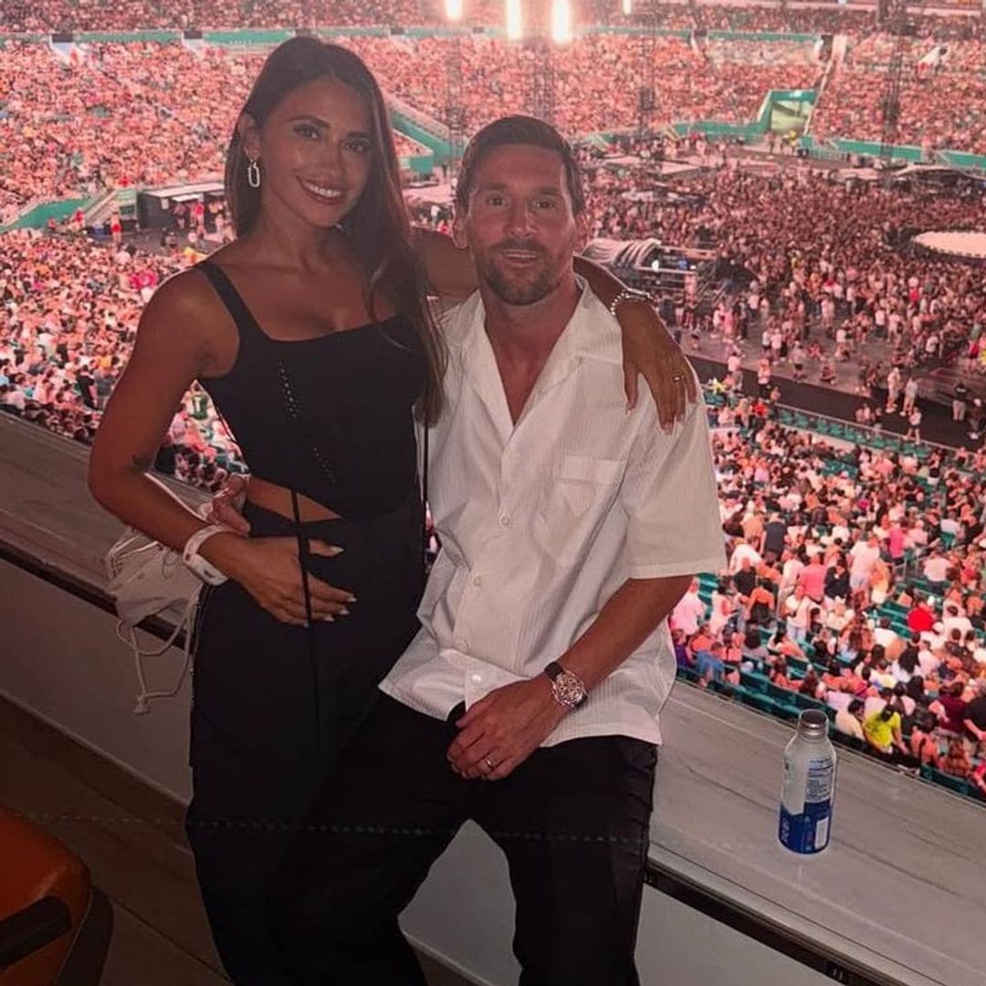 Lionel Messi blushes as he and Antonela Roccuzzo catch each other on the kiss cam at Coldplay's Miami concert