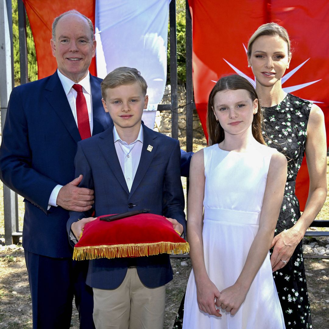 Princess Charlene steps out with her family in a black dress reminiscent of one Queen Letizia wore a decade ago