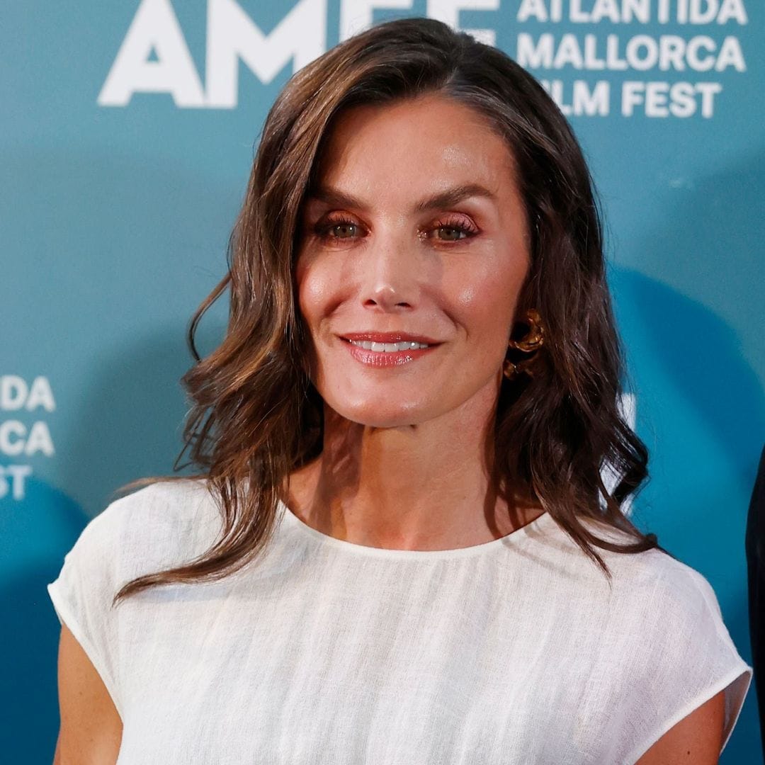 Queen Letizia stuns in a white corset dress and bold gold bracelet at Mallorca’s film fest