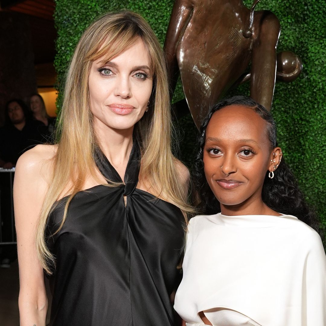 Angelina Jolie and Zahara hold hands and match in stunning black looks