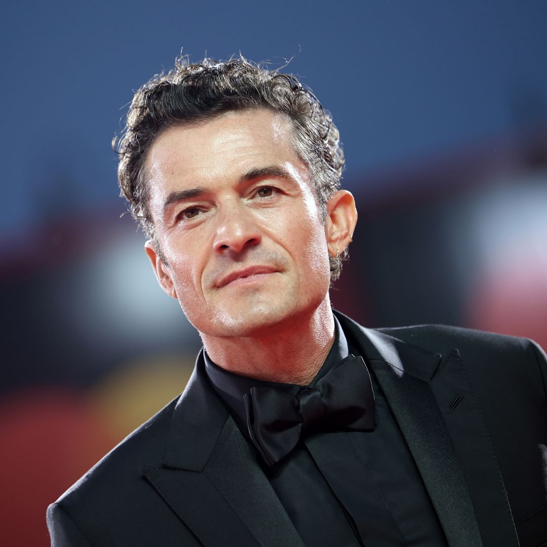Orlando Bloom flaunts his rock-solid abs during family getaway