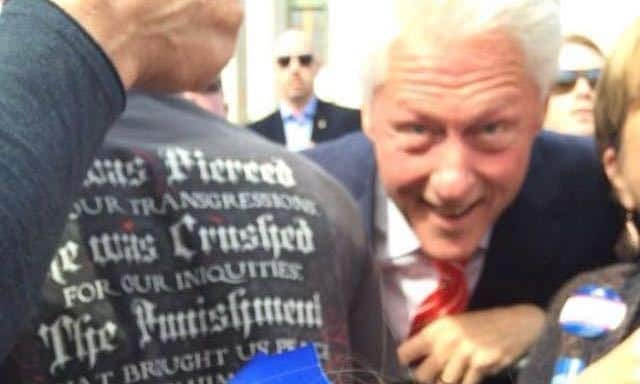 Too cute: Bill Clinton photobombs sad little girl