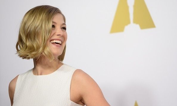 Rosamund Pike is a vision in white at Oscars Nominee Luncheon