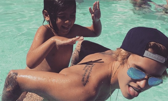 Shirtless, tanned Justin Bieber and Mason Disick have fun pool day