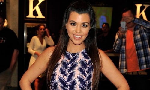 Kourtney Kardashian shows off post-baby abs six months after giving birth
