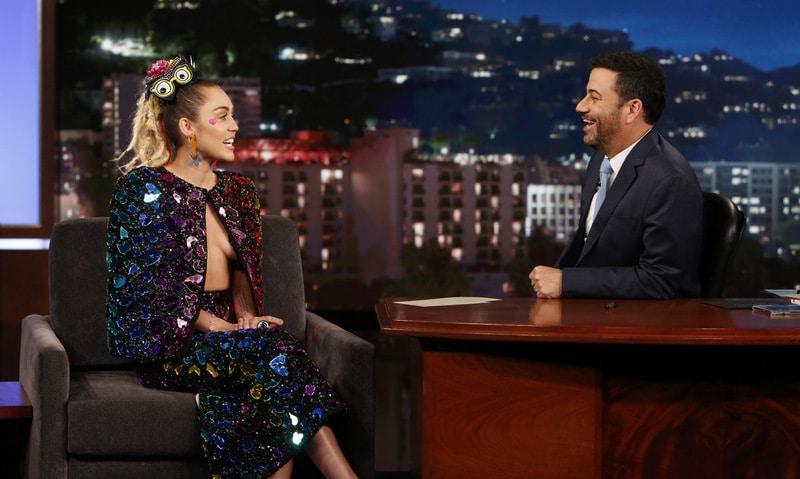 Miley Cyrus makes Jimmy Kimmel blush with revealing outfit
