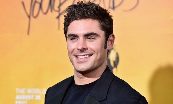 Zac Efron does the moonwalk while dressed as Snoopy in hilarious throwback video