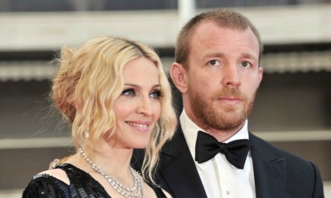 Guy Ritchie brings a bottle of wine as he visits Madonna's house 