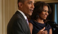 Michelle Obama: Barack 'doing well' when it comes to his daughters and boys