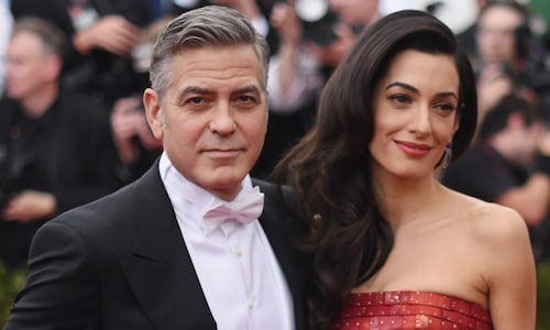 George Clooney calls Amal 'Olympic athlete' as a mom and talks fatherhood