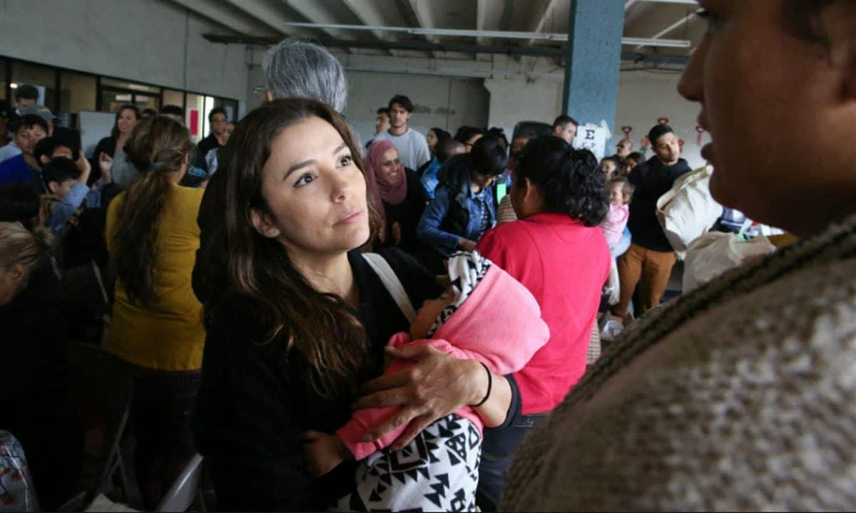 Emotional Eva Longoria cradles baby as she hears mother's story at Tijuana Border Crossing