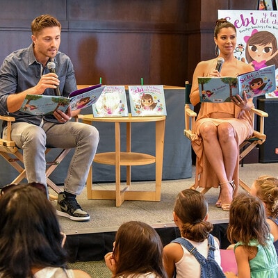Roselyn Sanchez and Eric Winter reading