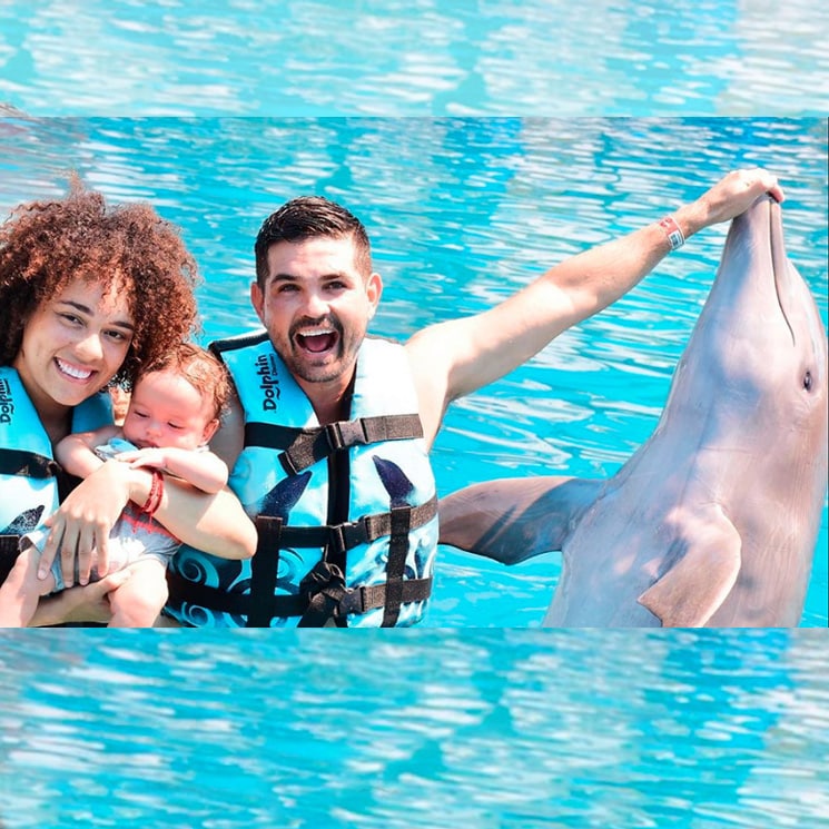 Ferdinando Valencia and Brenda Kellerman take son Tadeo to swim with dolphins