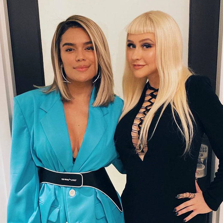 Karol G hangs out with Christina Aguilera at ‘The Addams Family’ premiere