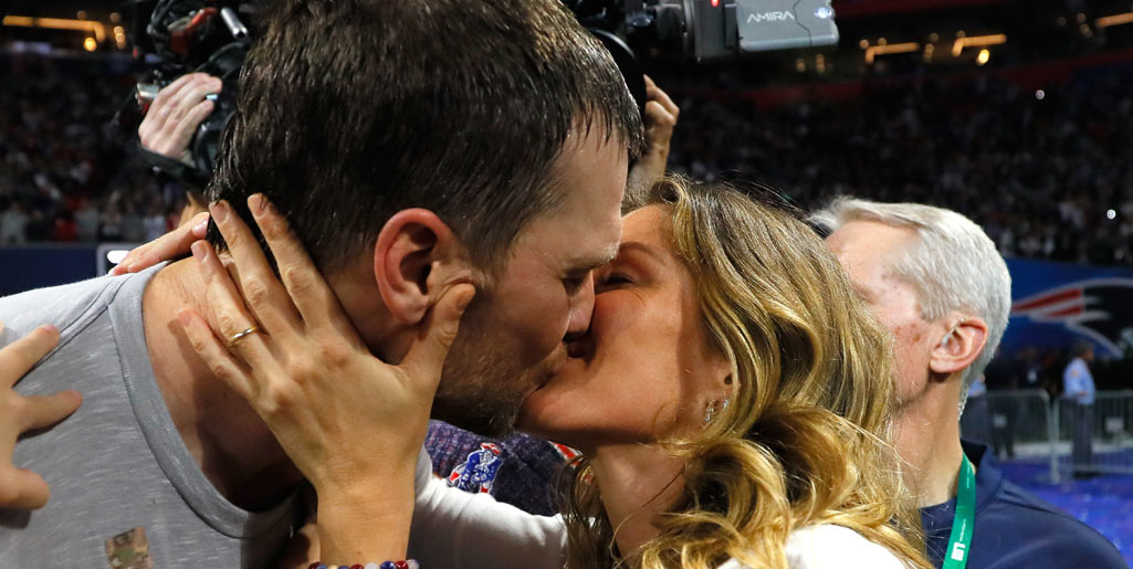 Gisele Bündchen plants kiss on Tom Brady as they celebrate Super Bowl win - see the sweet moment!