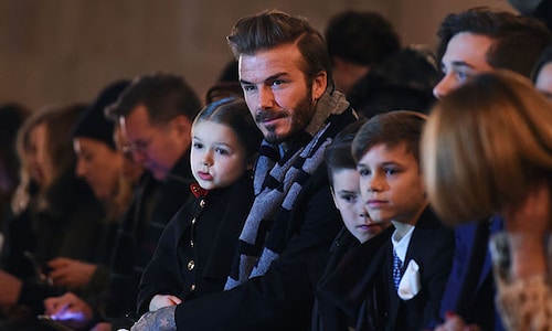 David Beckham sits front row with daughter Harper for Victoria Beckham's NYFW show