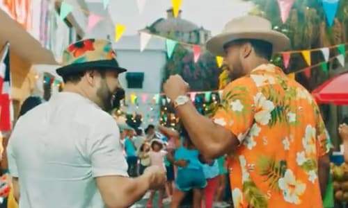Romeo Santos looks vacay-ready in a Guess x J Balvin shirt for new 'Canalla' music video