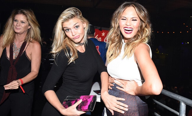 Chrissy Teigen shows off baby bump at videogame launch 