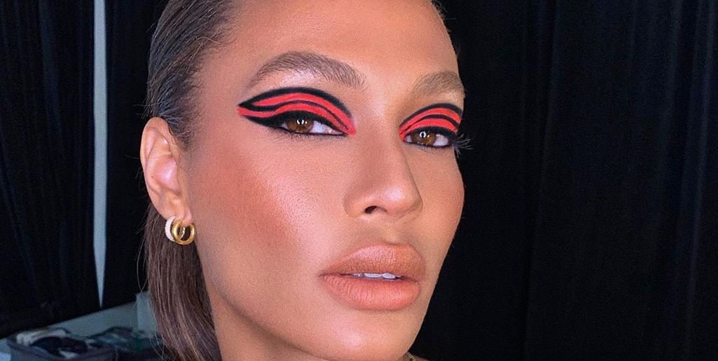 Joan Smalls’ bold orange makeup is totally on trend for summer