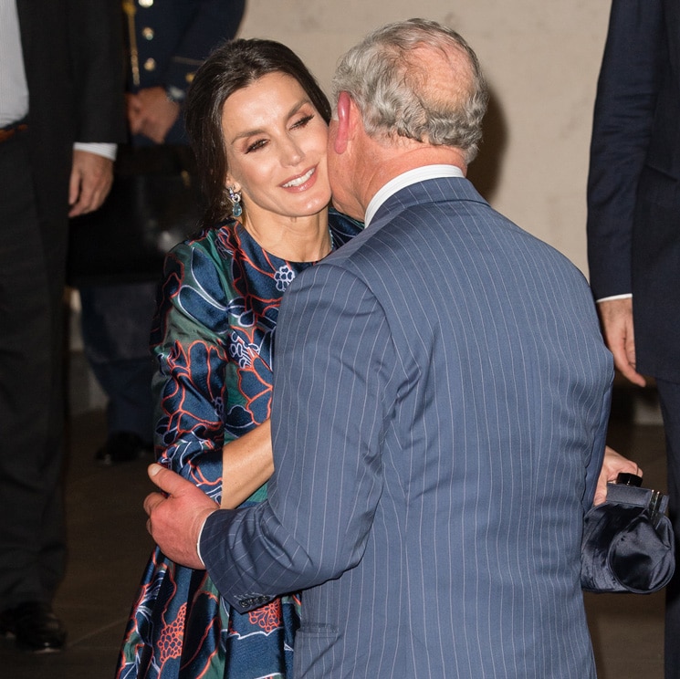 Queen Letizia gets a kiss on the cheek from Prince Charles on stylish night out